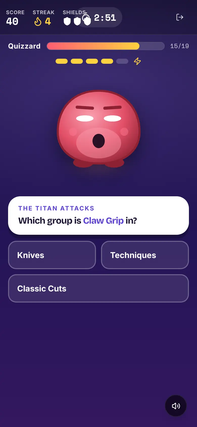 Term Titans on a phone: a red Titan with its health bar down to 15 of 19, a question card and three group buttons, with shields in the header.